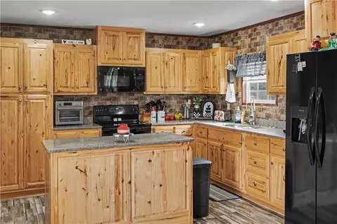 Kitchen - 115 NW 90th Ln, Lamar, MO 64759 photo 2 of 4
