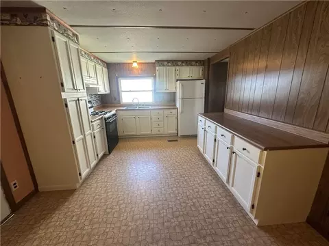 Kitchen - 411 W Pine St, Orrick, MO 64077 photo 1 of 2