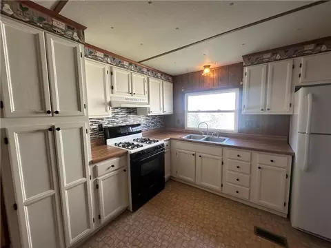 Kitchen - 411 W Pine St, Orrick, MO 64077 photo 2 of 2