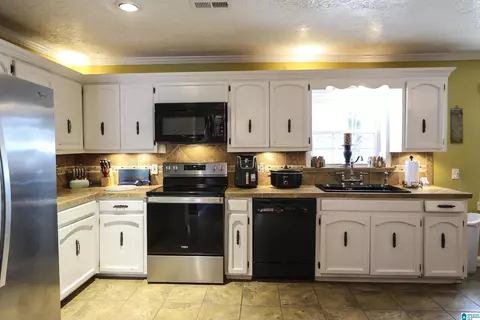 Kitchen - 106 Harper Dr, Ohatchee, AL 36271 photo 2 of 3