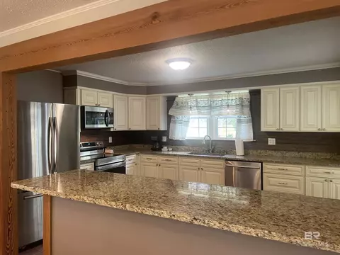 Kitchen - 13850 Celeste Rd, Chunchula, AL 36521 photo 1 of 4