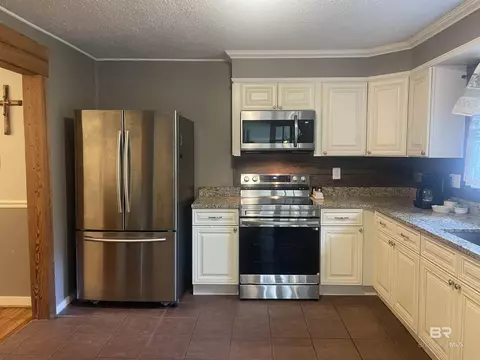 Kitchen - 13850 Celeste Rd, Chunchula, AL 36521 photo 2 of 4