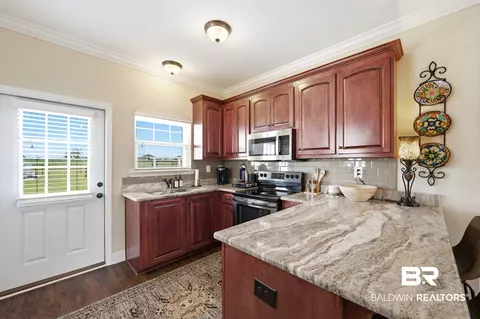 Kitchen - 8794 Baptist Cp, Elberta, AL 36530 photo 6 of 9