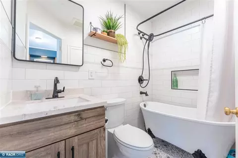 Bath - 101 E Indiana Ave, Gilbert, MN 55741 photo 1 of 1
