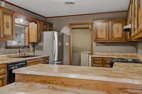 Kitchen - 104 S Everett St, Kennett, MO 63857 photo 3 of 4