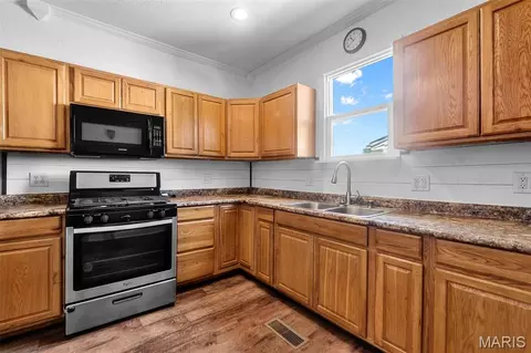 Kitchen - 401 N 3rd St, Chaffee, MO 63740 photo 2 of 3