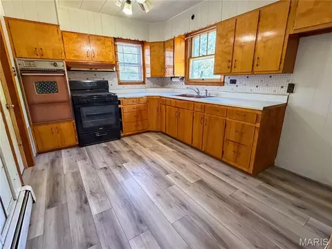 Kitchen - 311 E 1st North St, Mount Olive, IL 62069 photo 1 of 2