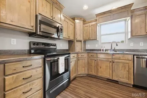 Kitchen - 105 Mars St, Holts Summit, MO 65043 photo 2 of 2
