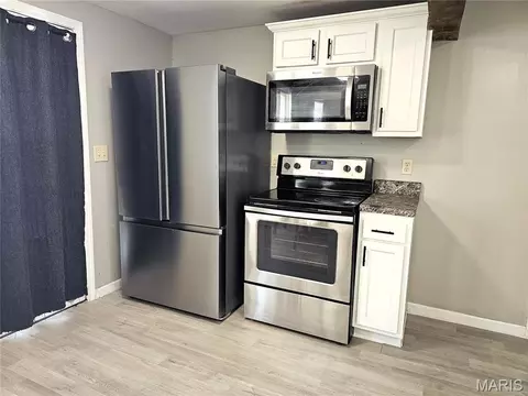 Kitchen - 120 E Warren St, Moweaqua, IL 62550 photo 2 of 3