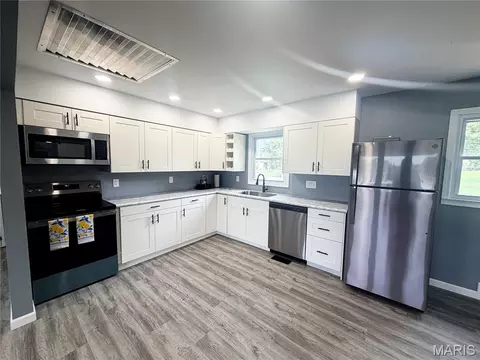 Kitchen - 601 Cooper Ave, Paris, MO 65275 photo 2 of 2