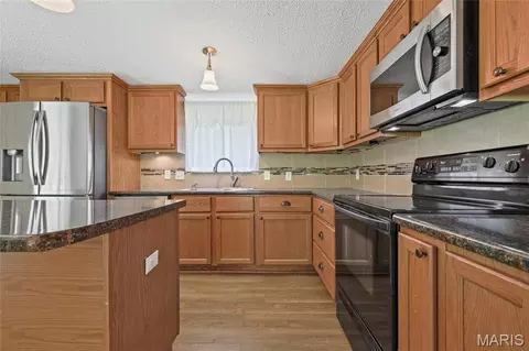 Kitchen - 7448 Turn Bo Ranch Rd, Dittmer, MO 63023 photo 3 of 7