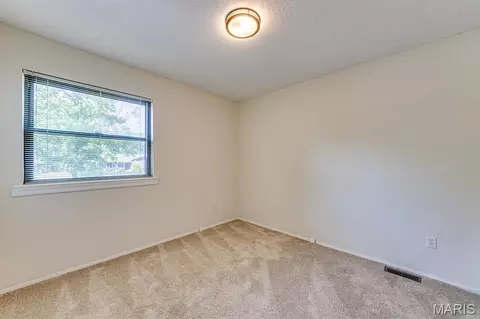 Bedroom - 230 Braeshire Dr #E, Ballwin, MO 63021 photo 9 of 12