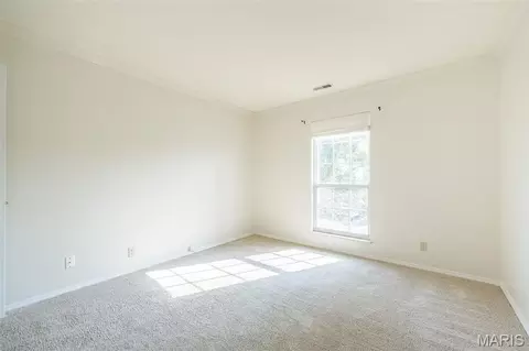 Bedroom - 1445 Whispering Creek Dr #E, Ballwin, MO 63021 photo 2 of 3