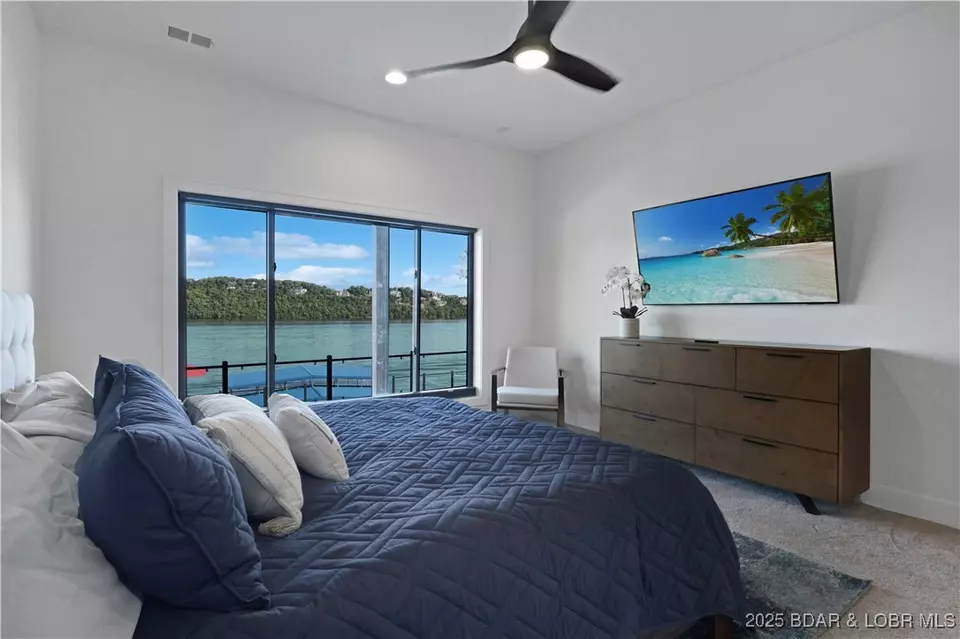 Bedroom - 1603 Grand View Dr, Sunrise Beach, MO 65079 photo 8 of 11