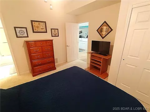 Bedroom - 910 E Harbour Towne Dr #E-910, Lake Ozark, MO 65049 photo 5 of 7