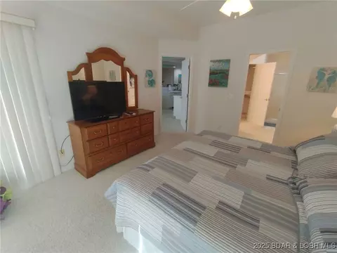 Bedroom - 910 E Harbour Towne Dr #E-910, Lake Ozark, MO 65049 photo 3 of 7