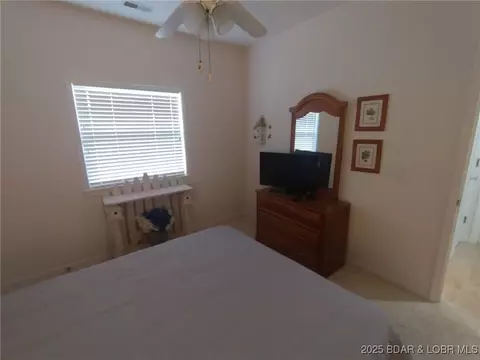 Bedroom - 910 E Harbour Towne Dr #E-910, Lake Ozark, MO 65049 photo 7 of 7
