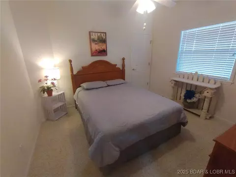 Bedroom - 910 E Harbour Towne Dr #E-910, Lake Ozark, MO 65049 photo 6 of 7