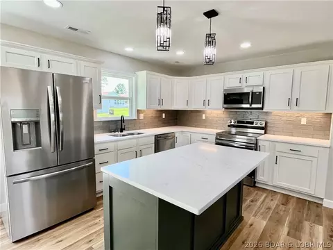 Kitchen - 602 Fourth St, Stover, MO 65078 photo 5 of 6