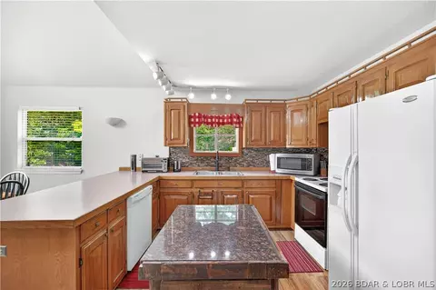 Kitchen - 1216 Robin Hood Ln, Roach, MO 65787 photo 2 of 3
