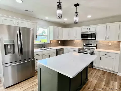Kitchen - 602 Fourth St, Stover, MO 65078 photo 5 of 6