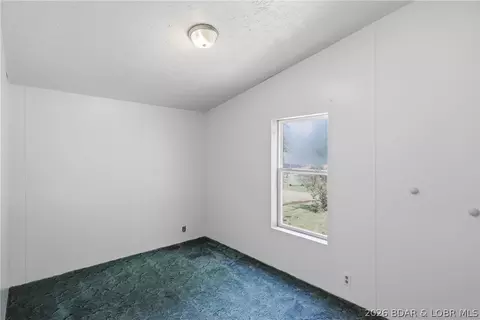 Bedroom - 405 8th St, Eldon, MO 65026 photo 4 of 11