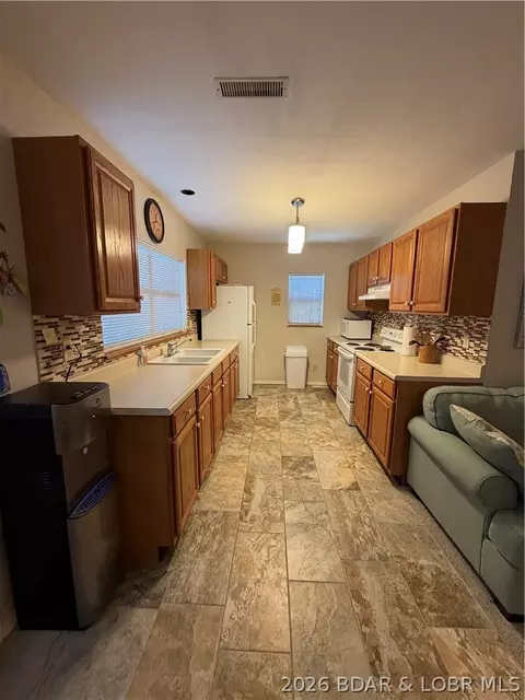 Kitchen - 30847 Rustic Rd, Rocky Mount, MO 65072 photo 2 of 3