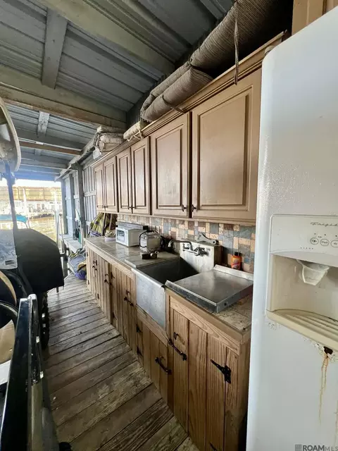Kitchen - 32875 Rivergate Cir # 1, Springfield, LA 70462 photo 1 of 3