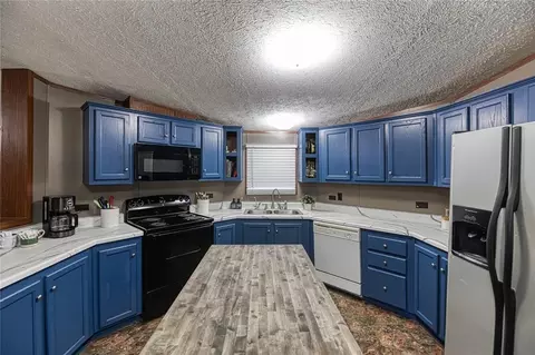 Kitchen - 302 N 8th St, Hammon, OK 73650 photo 2 of 3