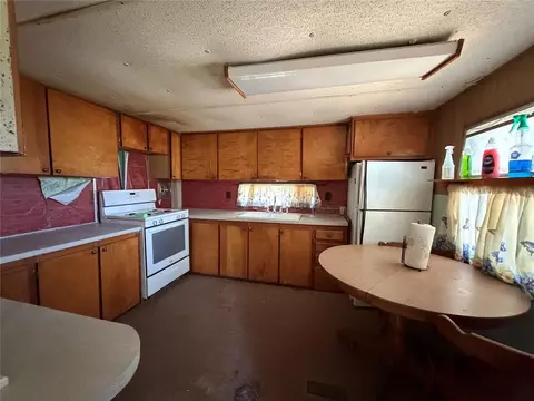 Kitchen - 20586 E 1476 Rd, Lone Wolf, OK 73655 photo 2 of 3
