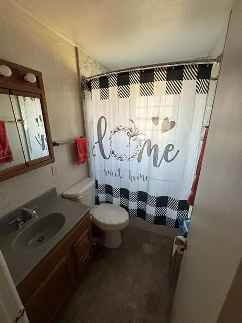 Bath - 722 E 8th St, Olustee, OK 73560 photo 1 of 2