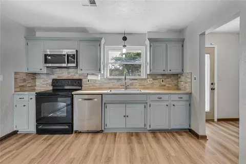 Kitchen - 324 E Carson Ln, Mustang, OK 73064 photo 2 of 2