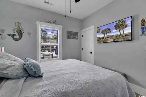 Bedroom - 668 Pacific Commons Dr, Surfside Beach, SC 29575 photo 2 of 9