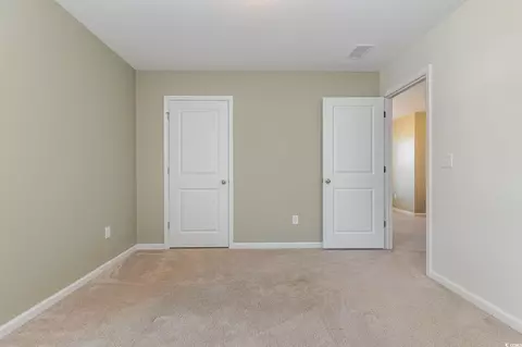 Bedroom - 160 Ocean Commons Dr, Surfside Beach, SC 29575 photo 3 of 7
