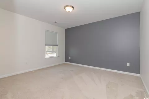 Bedroom - 160 Ocean Commons Dr, Surfside Beach, SC 29575 photo 6 of 7