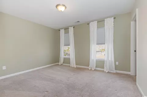 Bedroom - 160 Ocean Commons Dr, Surfside Beach, SC 29575 photo 2 of 7