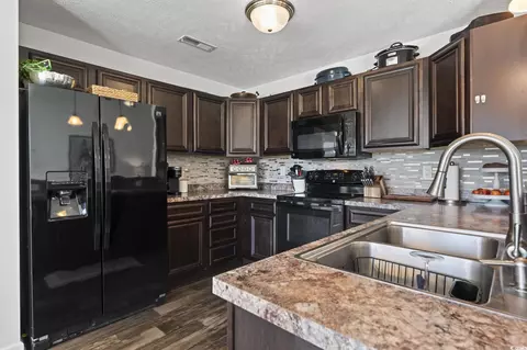 Kitchen - 313 Palladium Dr, Surfside Beach, SC 29575 photo 2 of 3
