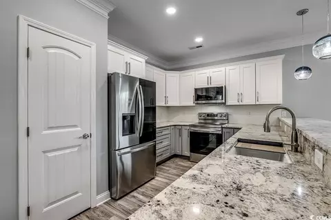 Kitchen - 723 10th Ave S, Surfside Beach, SC 29575 photo 2 of 3