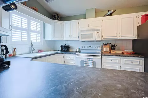 Kitchen - 412 Cypress Dr, Surfside Beach, SC 29575 photo 3 of 3