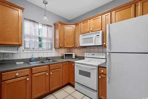 Kitchen - 113 7th Ave Apt A 7th Ave S, Surfside Beach, SC 29575 photo 2 of 2