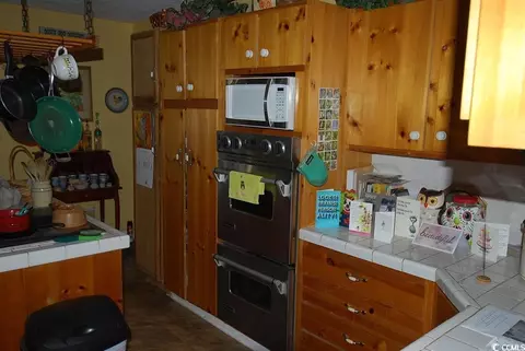 Kitchen - 1014 S Cedar Dr, Surfside Beach, SC 29575 photo 3 of 3