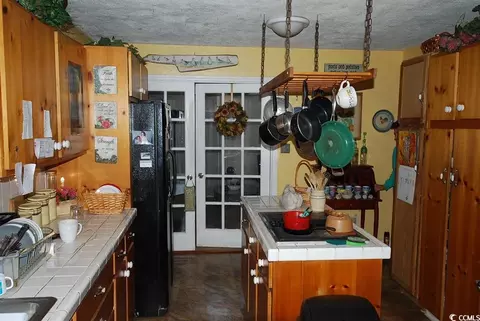 Kitchen - 1014 S Cedar Dr, Surfside Beach, SC 29575 photo 2 of 3
