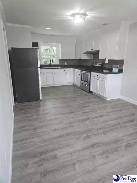 Kitchen - 314 E Country Club Dr, Dillon, SC 29536 photo 1 of 2
