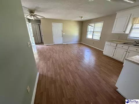 Living - 705 E Moore St, Olanta, SC 29114 photo 2 of 2