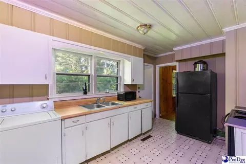 Kitchen - 411 E Leitner St, Latta, SC 29565 photo 1 of 4