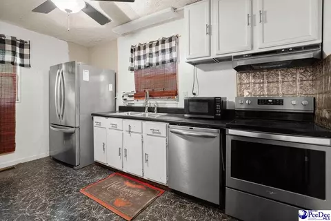 Kitchen - 73 E Cypress Ave, Mcbee, SC 29101 photo 2 of 3