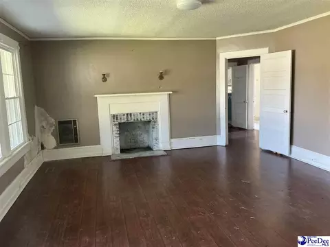 Living - 616 E Hampton St, Olanta, SC 29114 photo 1 of 2