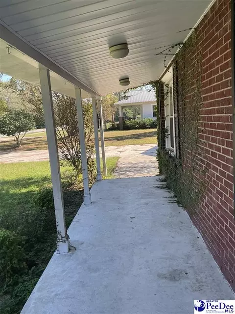 Exterior - 616 E Hampton St, Olanta, SC 29114 photo 6 of 11
