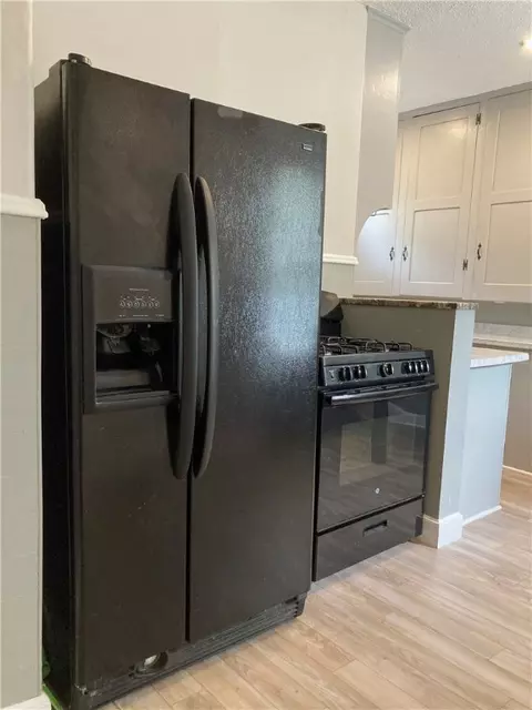 Kitchen - 437 Main St, Woonsocket, RI 02895 photo 2 of 7