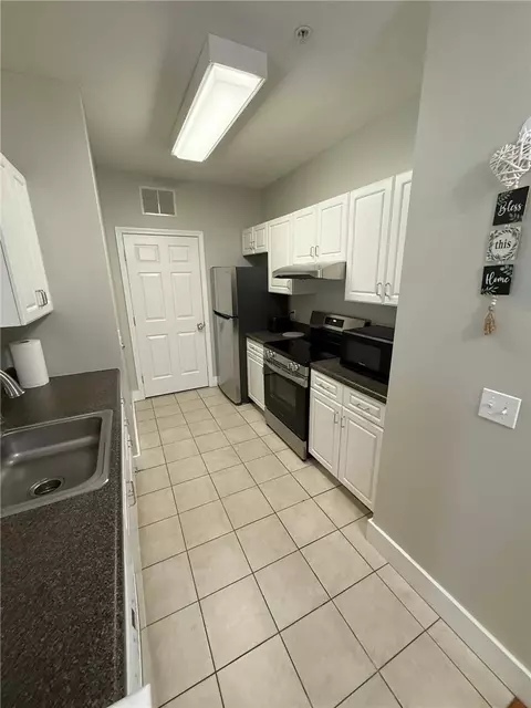 Kitchen - 114 Mill St #101, Woonsocket, RI 02895 photo 1 of 2